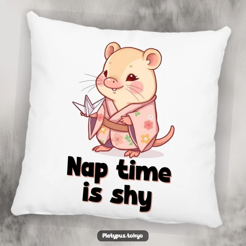 Funny shy platypus pillow in a floral kimono, sweetly offering a delicate paper crane, adding comfort and charm.