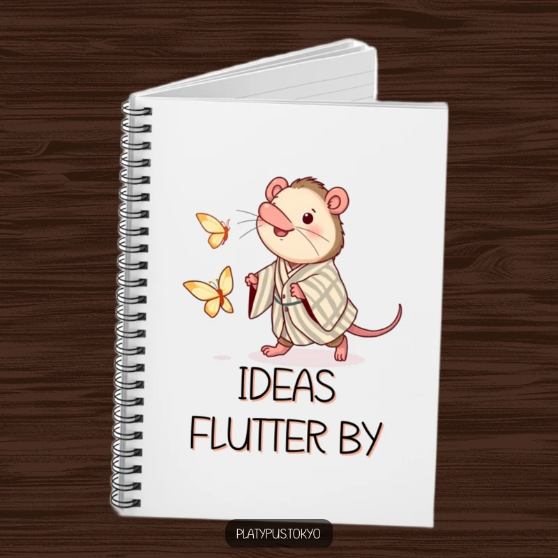 Funny notebook adorned with a platypus in a kimono, excitedly chasing a fluttering paper butterfly, inspiring creativity.